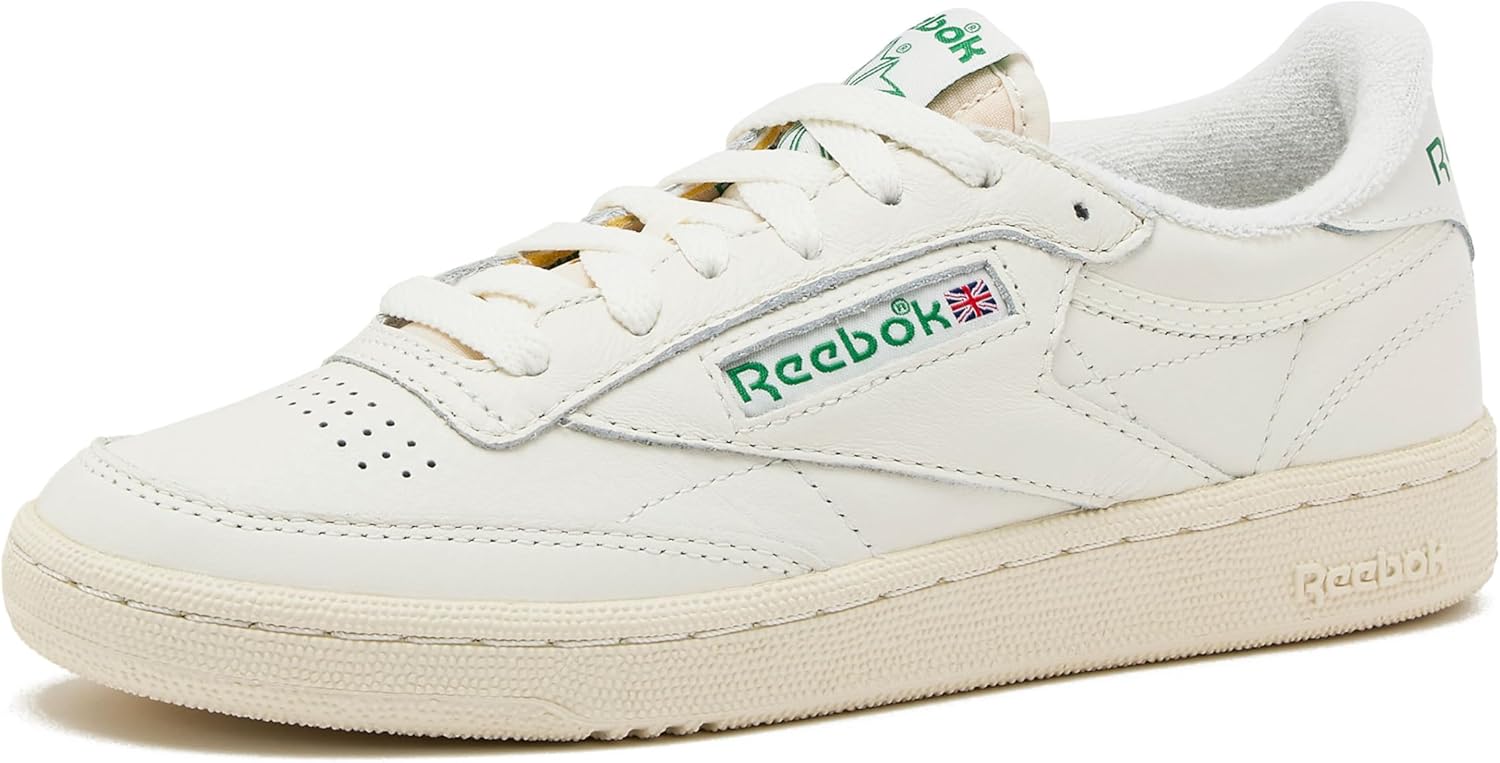 Reebok men's classic leather sneaker in white and navy, featuring the iconic side stripe and cushioned sole for all-day comfort โ view 1