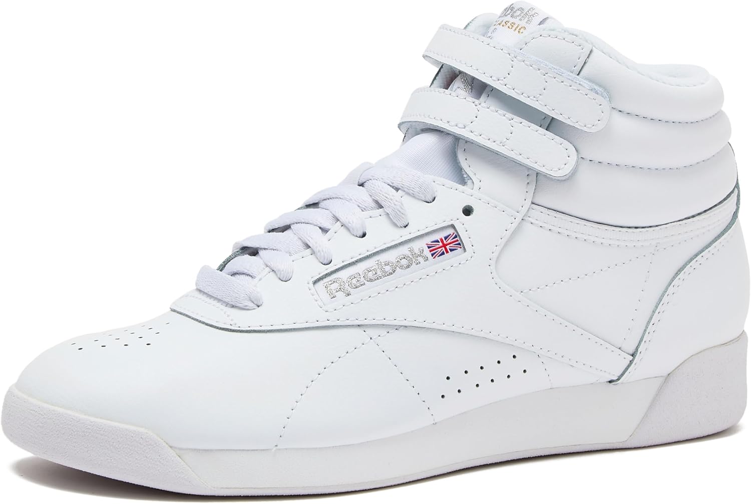 Reebok Women's Freestyle Hi high-top basketball sneaker in white and black colorway, showcasing classic retro silhouette with padded ankle collar and rubber sole โ view 1