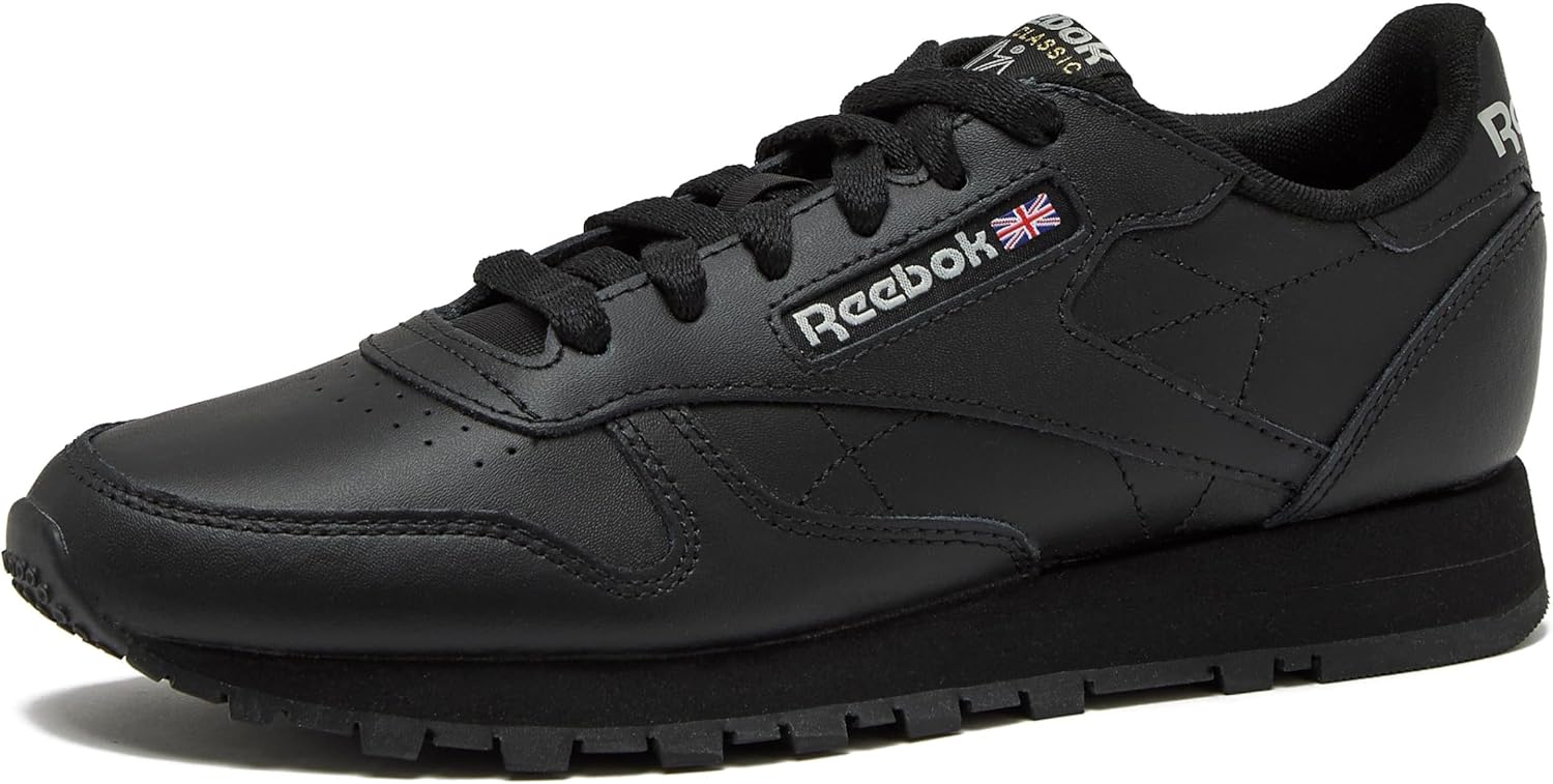 Reebok Classic Leather black sneaker for women displayed on white background, showcasing the iconic tennis shoe silhouette available in women's sizes 5 through 11 โ view 1