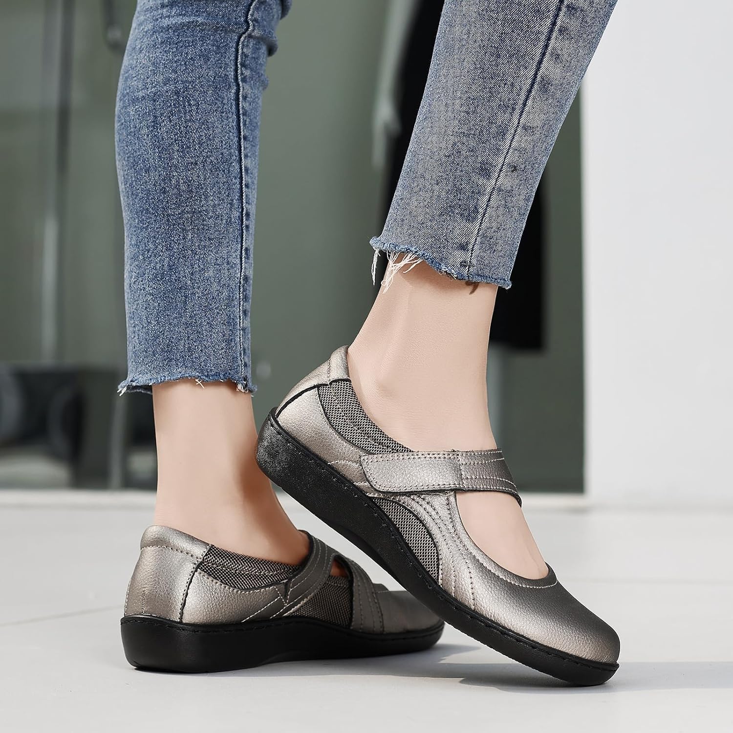 Oviaric women's classic Mary Jane flats in black with closed toe design and slip-on construction, shown from the side on a white background โ view 2