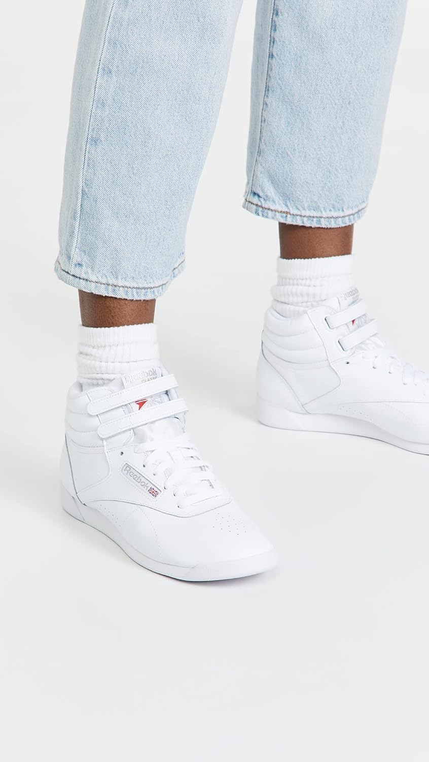 Reebok Women's Freestyle Hi high-top basketball sneaker in white and black colorway, showcasing classic retro silhouette with padded ankle collar and rubber sole โ view 2