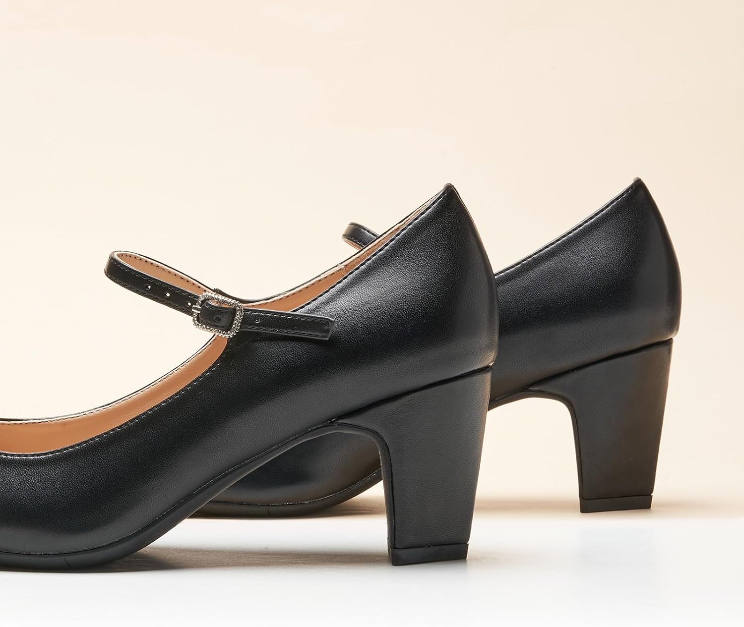 Neutral chunky heel pumps with closed round toe design, featuring a low heel and classic silhouette suitable for work and casual wear — view 2