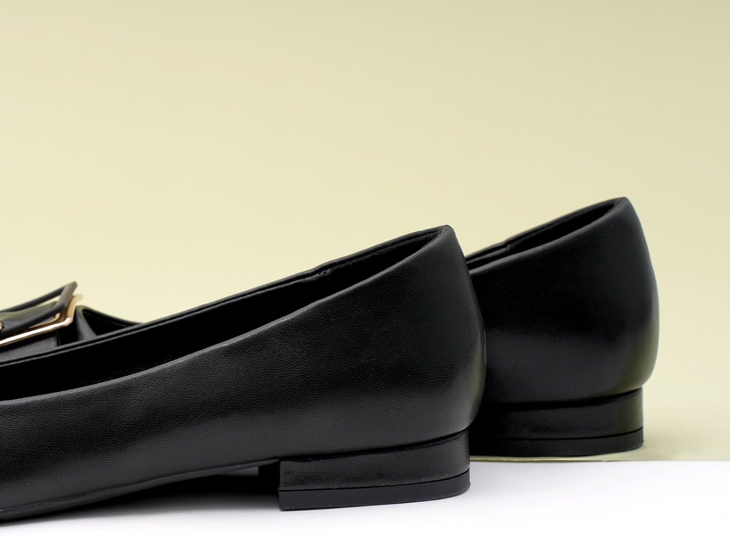 Neutral pointed-toe square buckle ballet flats with slip-on design, displayed on a neutral background — view 4