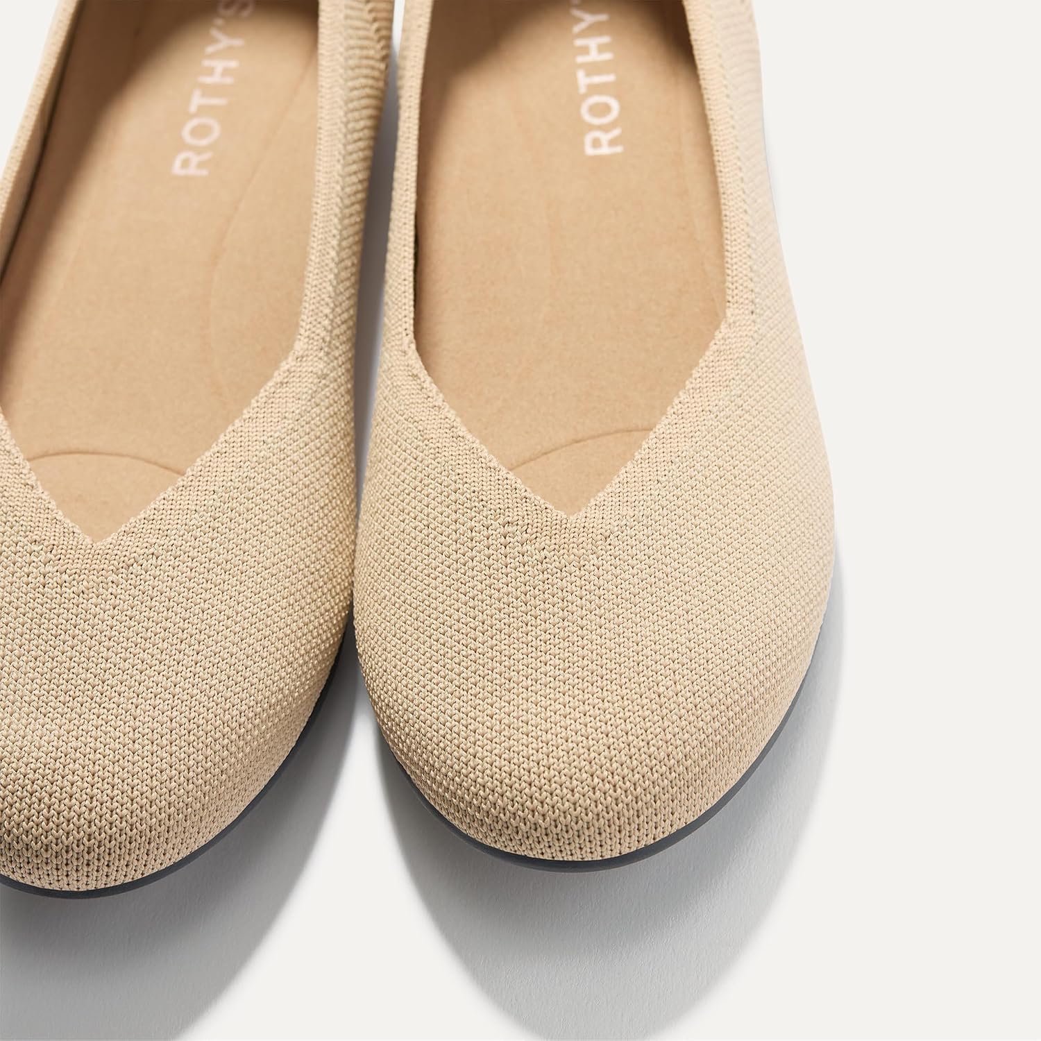 Neutral pointed-toe ballet flat with slip-on design and cushioned insole, shown from the side — view 4