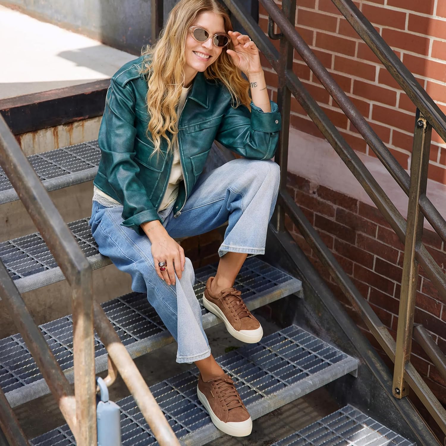 Pair of minimalist white sneakers with neutral tone, designed for casual wear and travel — side
